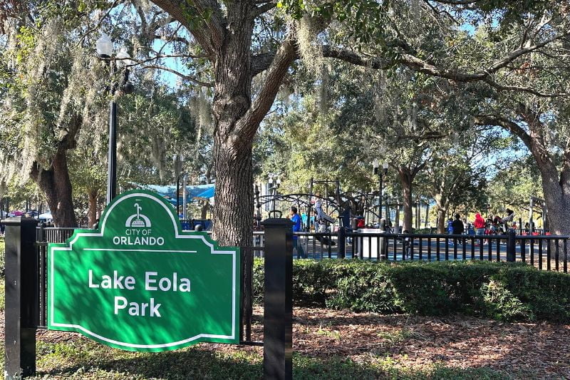 Playground at Lake Eola Park with Lake Eola Park sign in foreground