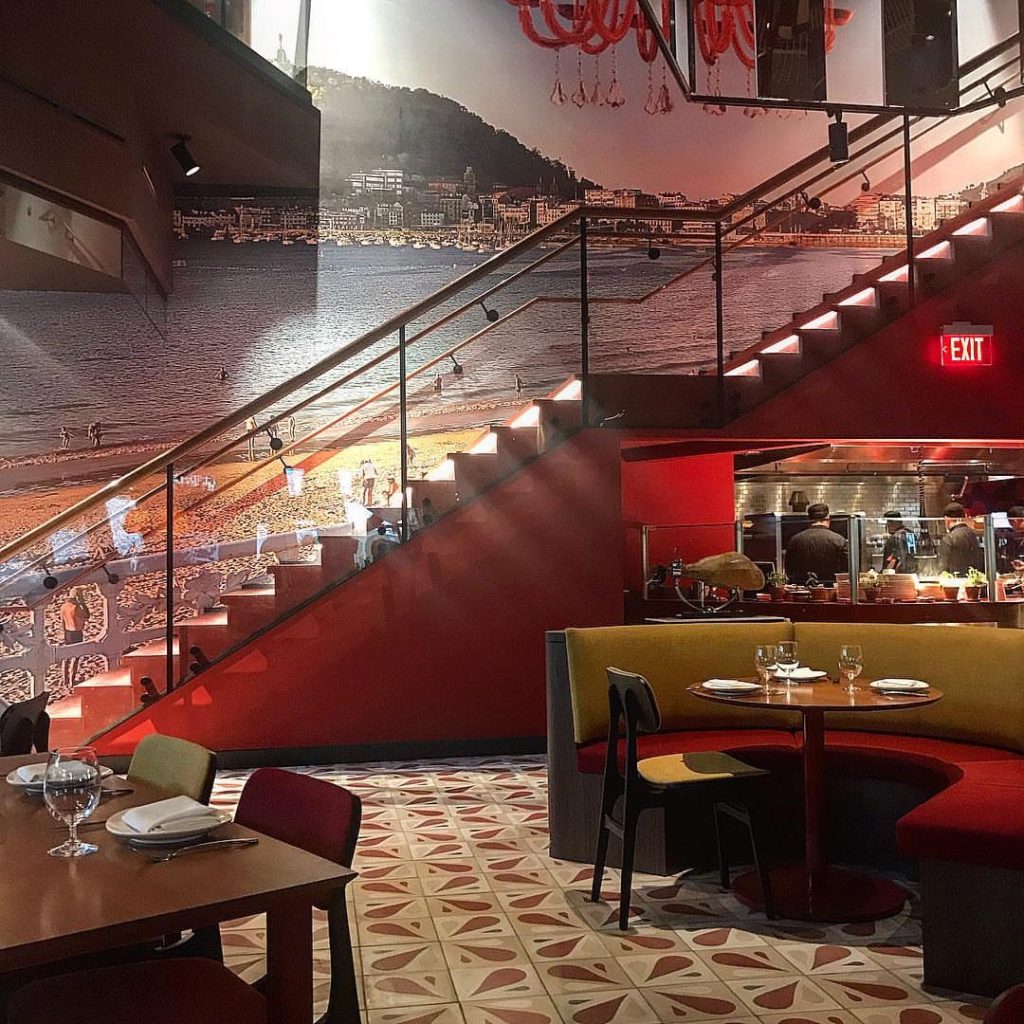 Jaleo by Chef Jose Andres has rich tones with red accents and dark woods
