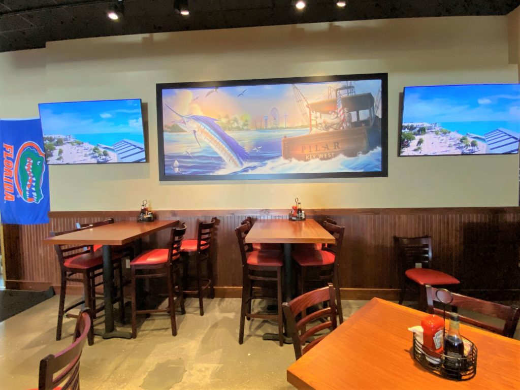 Live Stream of Mallory Square is shown on two flat panel tvs atSloppy Joe's of ICON Park Orlando