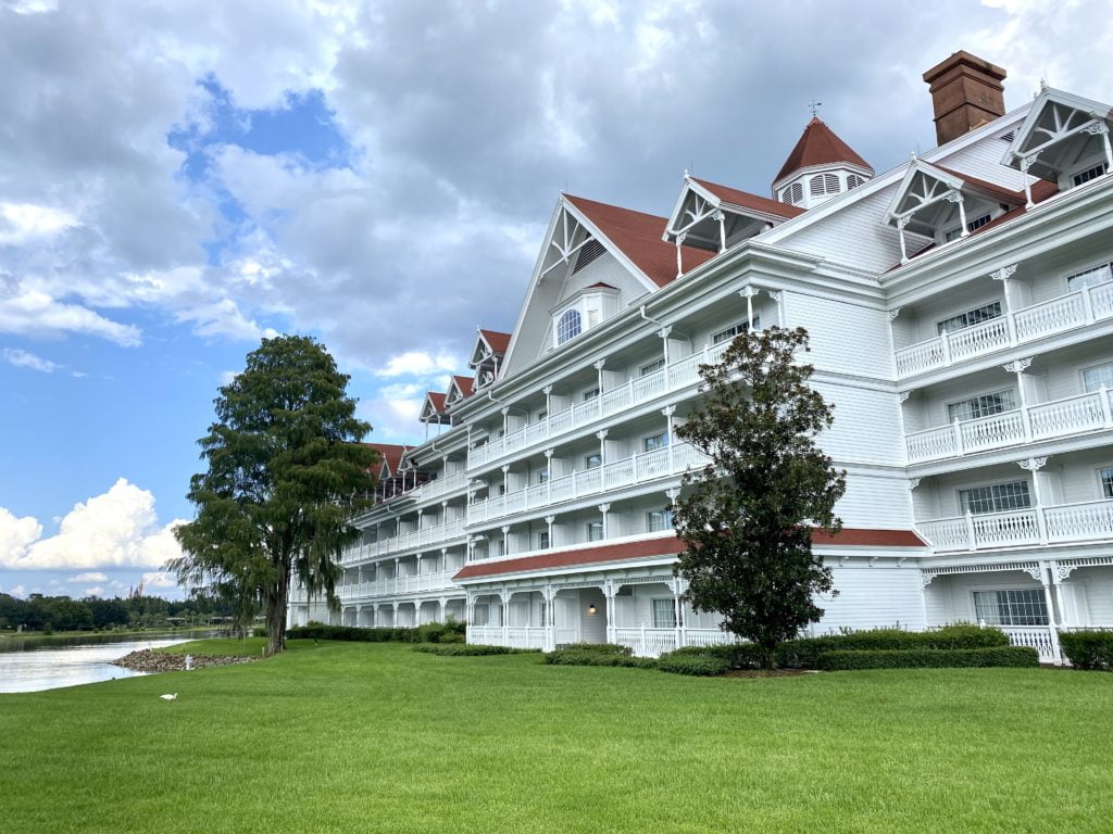 Disney's Grand Floridian Resort hotel is a Deluxe Level Hotel at Walt Disney World and has individual buildings of hotels rooms, with a white exterior and rich orange roof. This hotel building is near Magic Kingdom and overlooks Seven Seas Lagoon