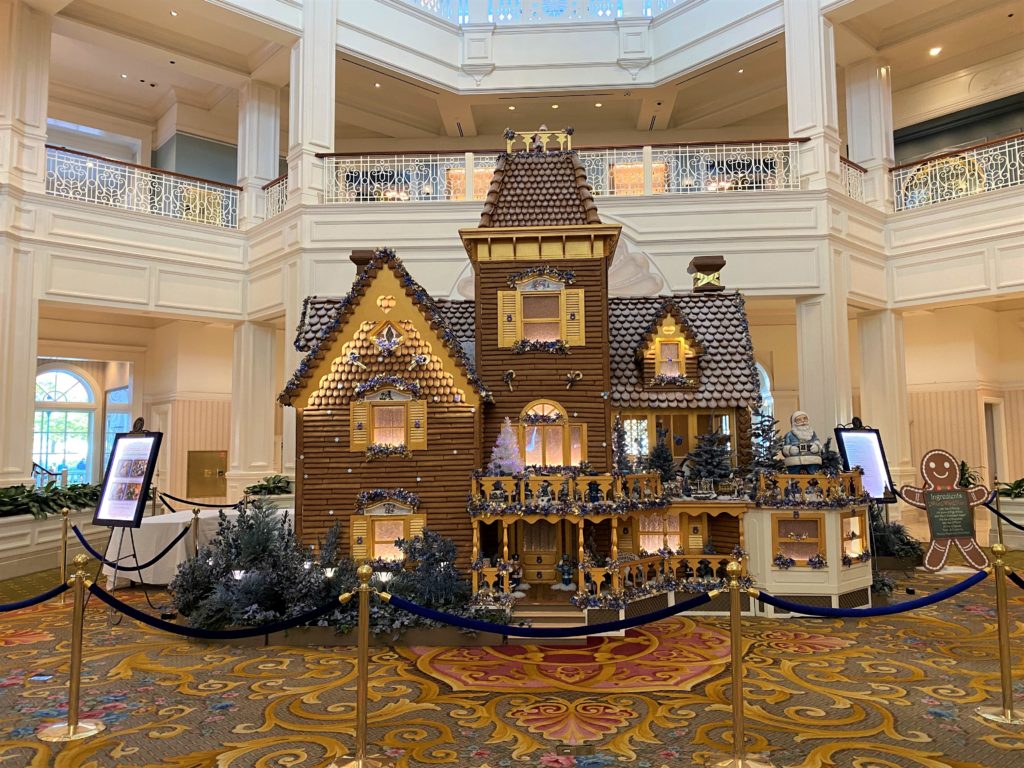 The 2021 Gingerbread House at Disney's Grand Floridian Resort and Spa is given a golden look to celebrate the 50th anniversary of Walt Disney World