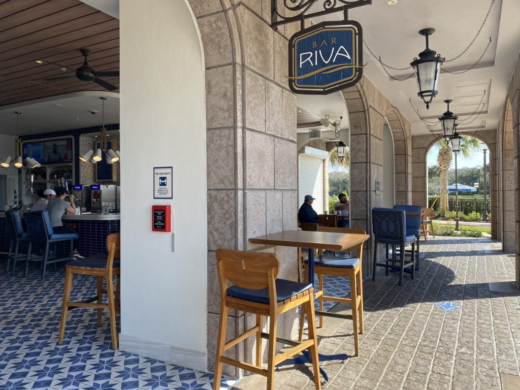 Bar Riva at Disney's Riviera Resort is a poolside bar with open air seating and a blue and white color scheme