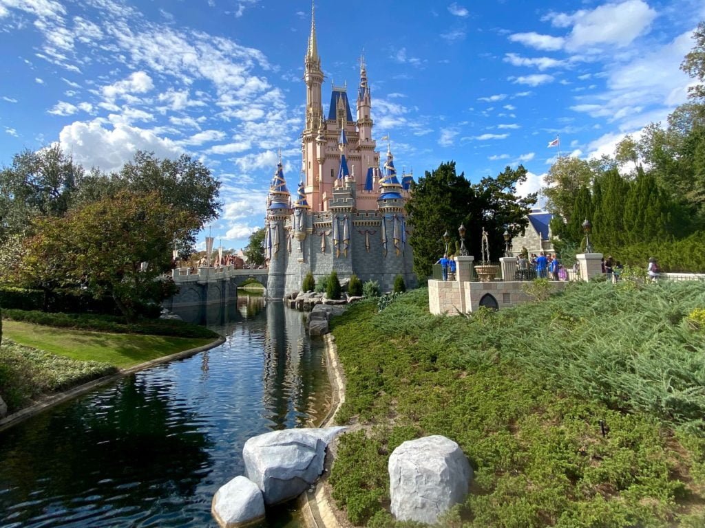 Cinderella Castle with Walt Disney World as seen from Fantasyland bridge, this shows the castle from the side with a winding moat leading to it