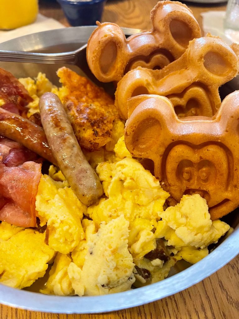 Breakfast Skillet at Trail's End Restaurant includes mickey waffles, bacon, scrambled eggs, sausage, and more