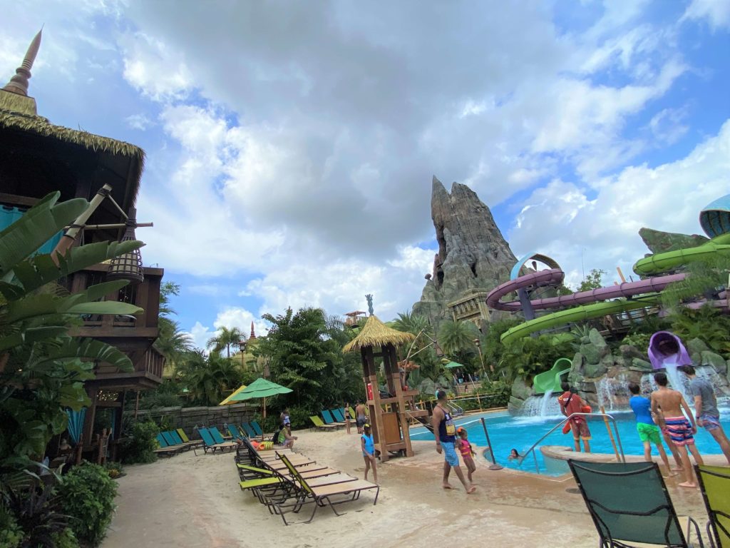 Puka Uli Lagoon at Volcano Bay with cabanas on the left and the volcano icon in the background