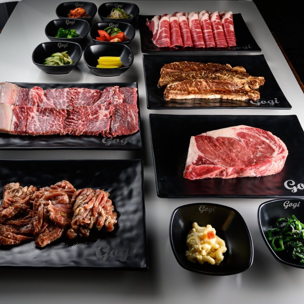 a selection of meat and accompaniments at Korean Gogi Grill