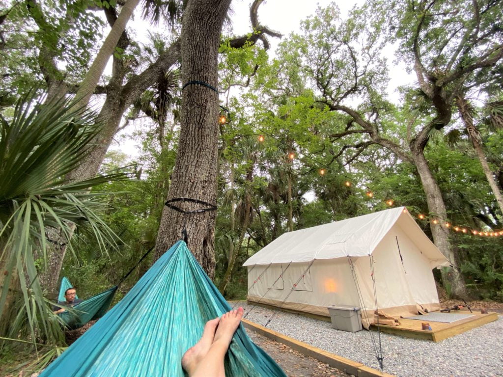 Relaxing in the hammocks at Timberline Tampa Glamping Site 25