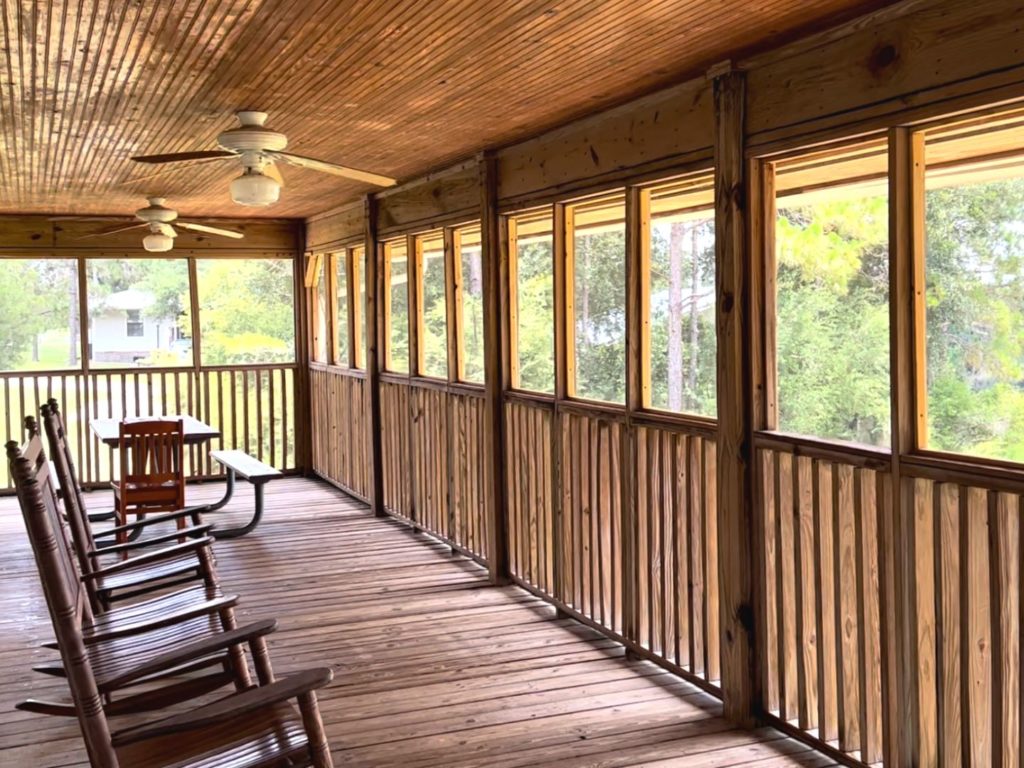 Lake Louisa State Park Cabins - Porch with rocking chairs, table, and ceiling fans