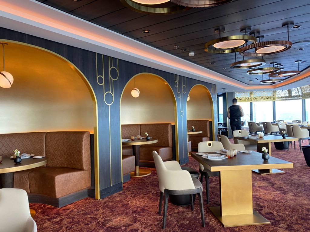 Palo Steakhouse Dining Room with panoramic windows on Disney Wish