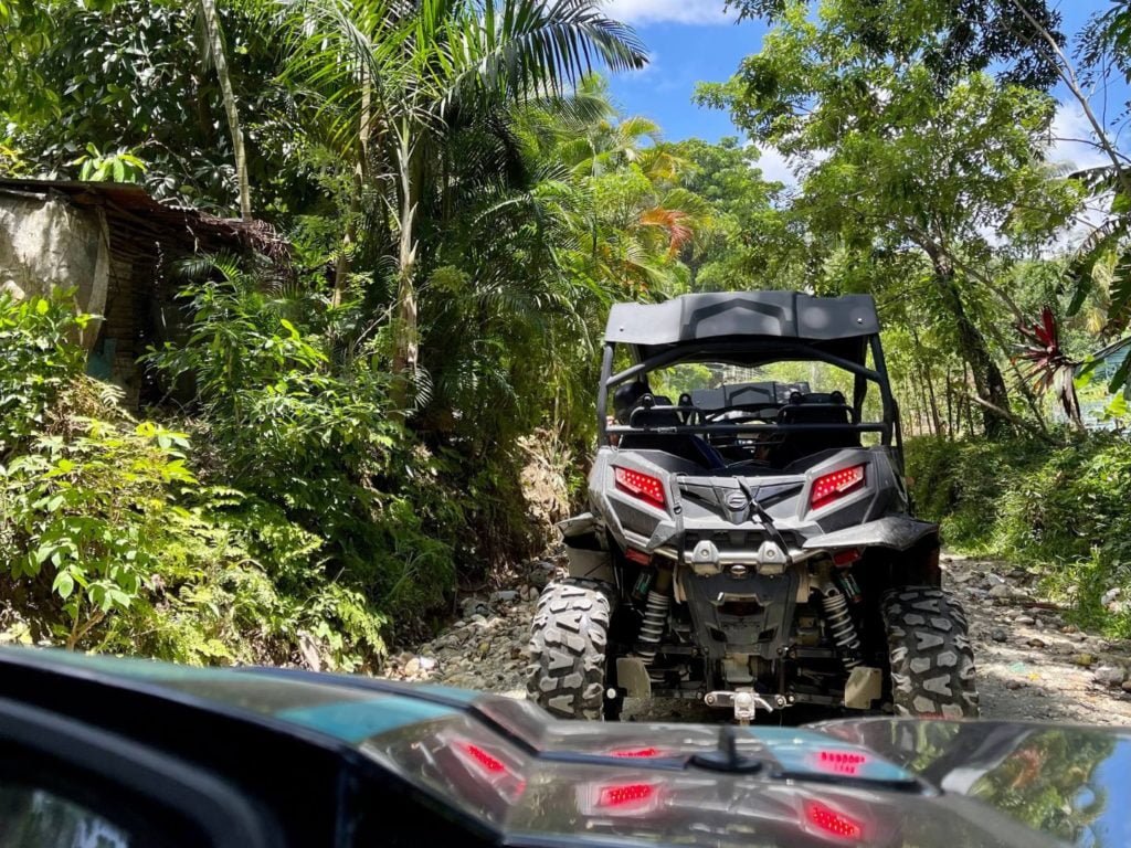 A view of a all terrain vehicle on a dirt road in the jungle during a Jungle Buggy Excursion in Puerto Plata