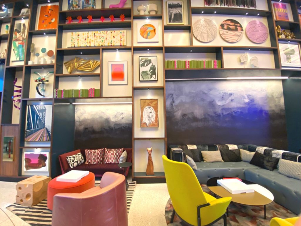 Bright artwork and colorful furniture in the Lake Nona Wave Hotel's lobby lounge 