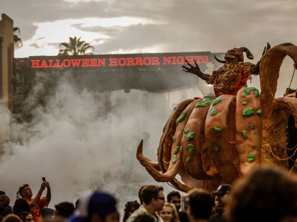 The Pumpkin Lord character greets guests in a gruesome way at Halloween Horror Nights 2022 Horrors of Halloween Scare Zone