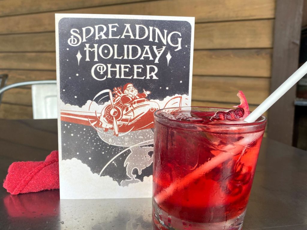 festively red colored cocktail Jingle G&T at Jock Lindsay's Disney Springs 