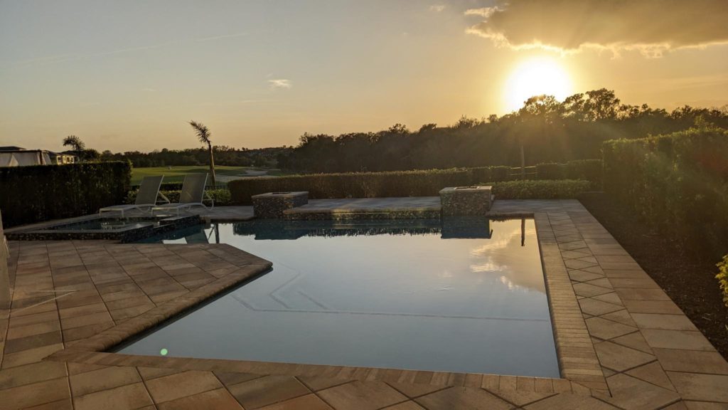 sun setting over a Pool at Vacation Home at Bear's Den Kissimmee - Michelle Spitzer