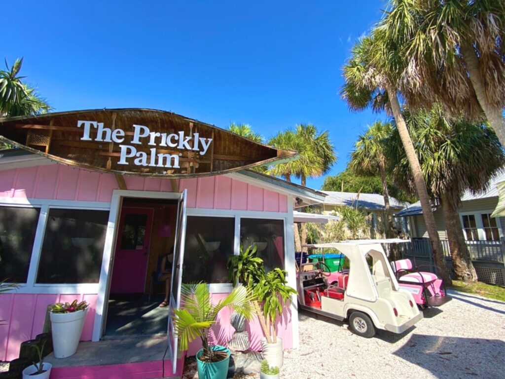 bright pink exterior of The Prickly Palm Cedar Key Restaurant - Dani Meyering