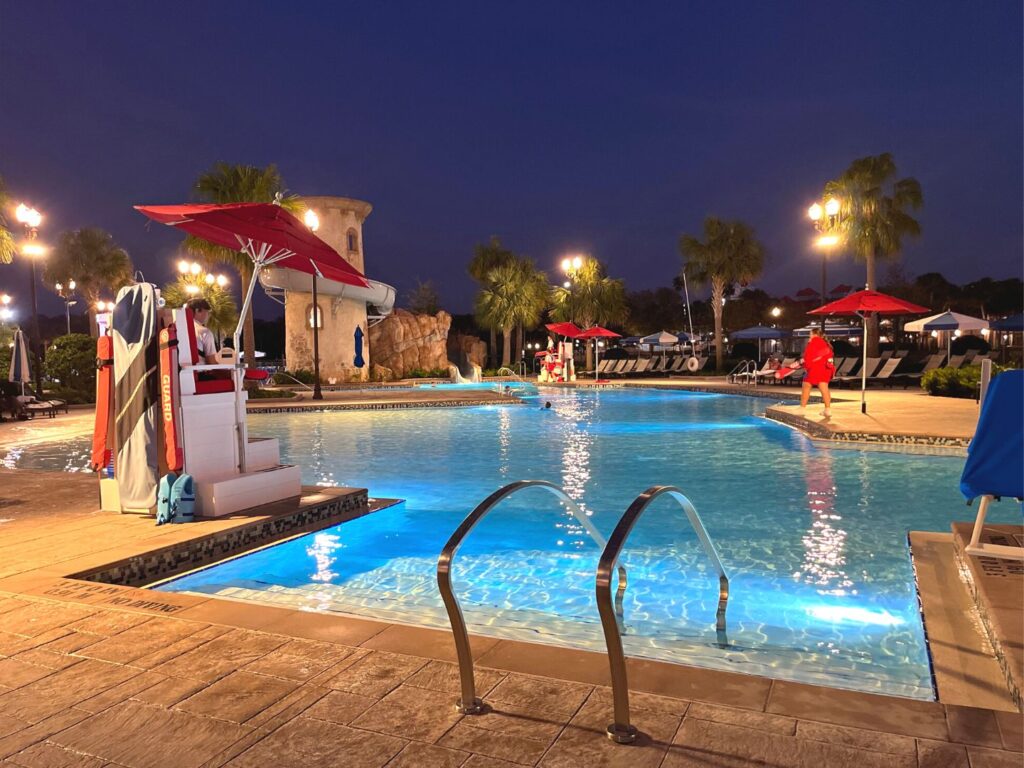Main Pool at Disney's Riviera Resort at nighttime 
